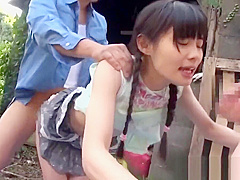A beautiful girl is outdoors being fingered by two men and gets bukkake’d.